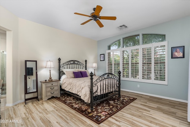 bedroom with wood finished floors, baseboards, and a ceiling fan