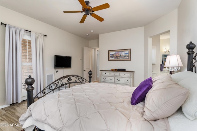 bedroom featuring wood finished floors and ceiling fan