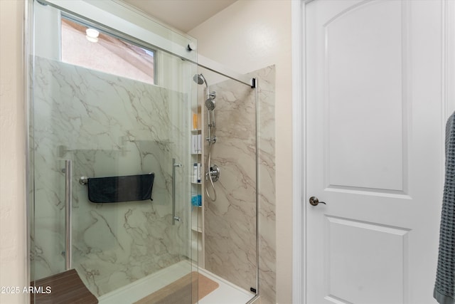full bath with a marble finish shower