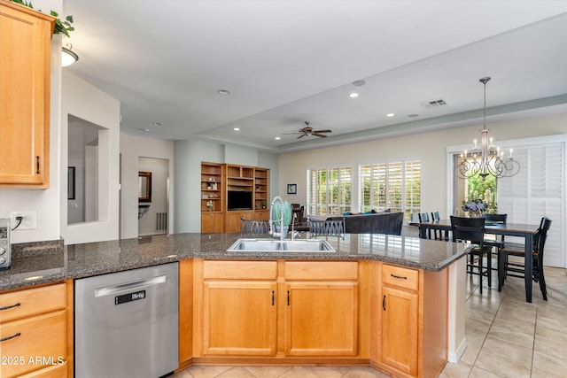 kitchen with stainless steel dishwasher, a sink, light tile patterned floors, a chandelier, and ceiling fan