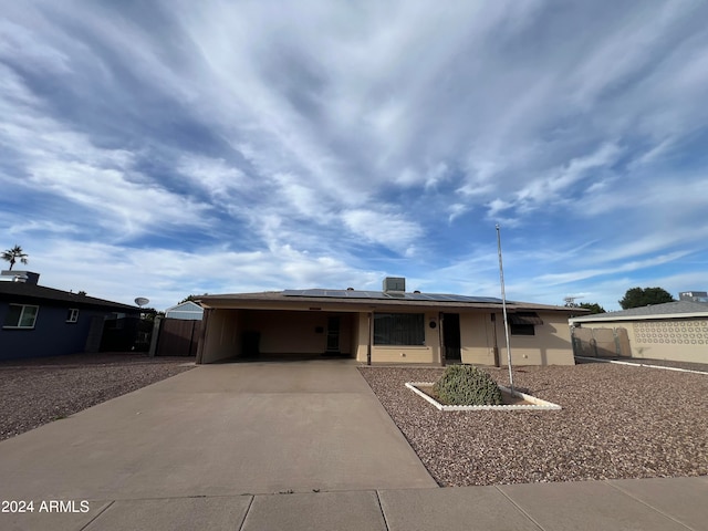 view of front of house with a carport