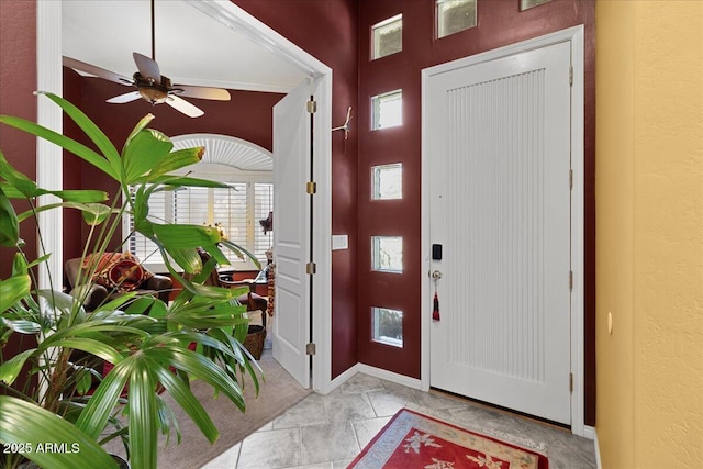 entryway featuring ceiling fan and light marble finish flooring