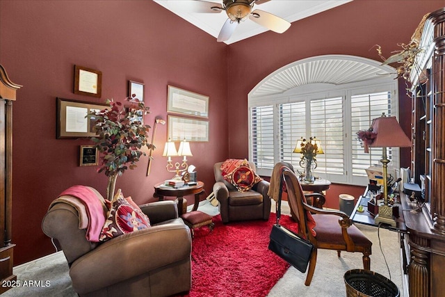 carpeted office featuring a ceiling fan and baseboards