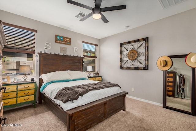 bedroom with visible vents, carpet flooring, baseboards, and a ceiling fan