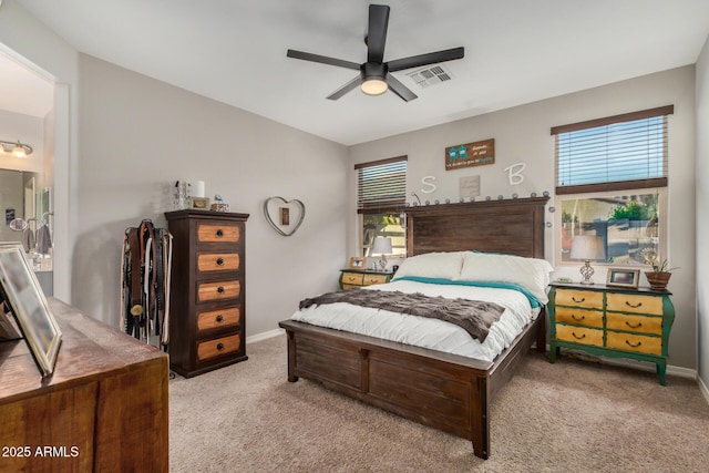 bedroom with baseboards, ceiling fan, carpet flooring, and visible vents