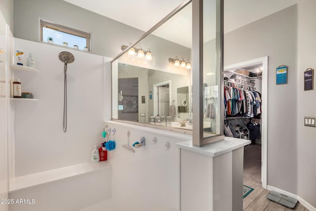 full bath with a spacious closet