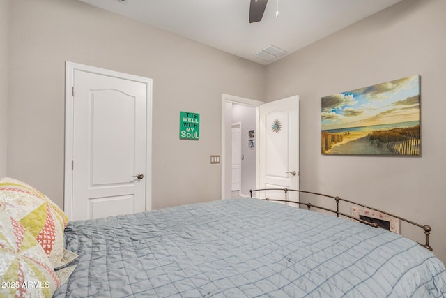 bedroom with visible vents and a ceiling fan