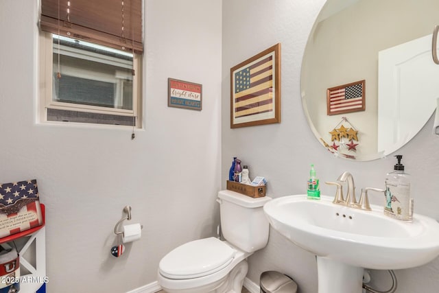 bathroom with a sink and toilet
