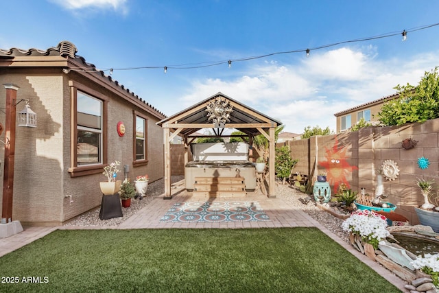 view of patio / terrace featuring a gazebo and a fenced backyard