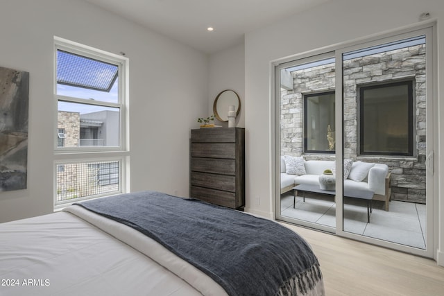 bedroom with light hardwood / wood-style flooring