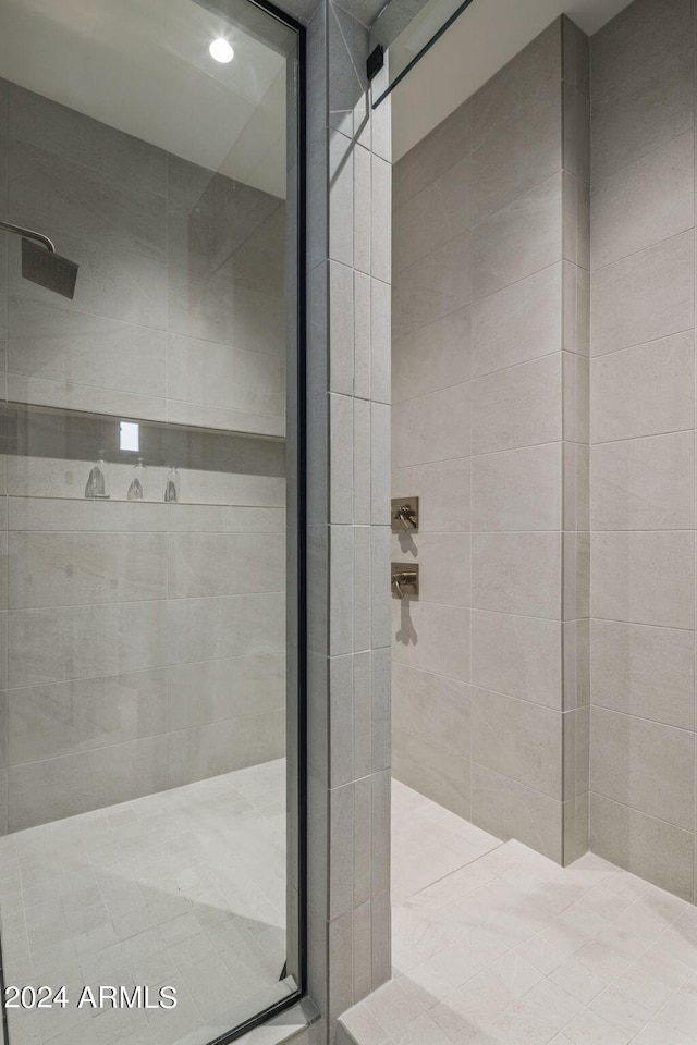 bathroom with tiled shower