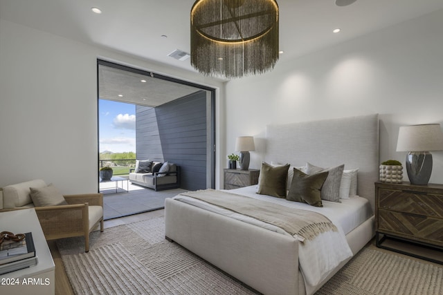 bedroom with access to exterior and floor to ceiling windows