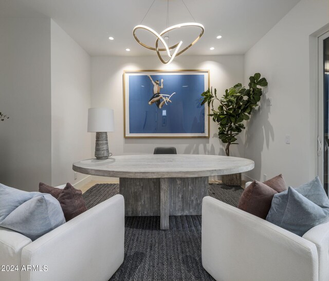 dining space featuring a notable chandelier