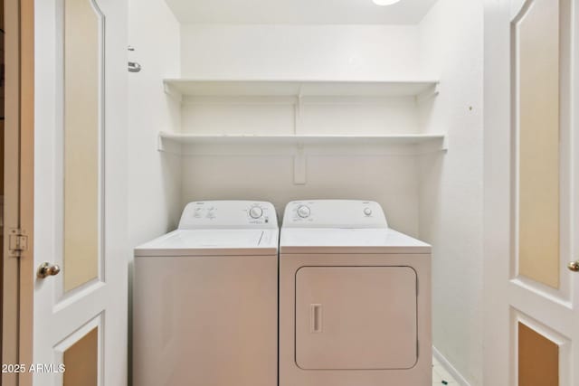 clothes washing area with independent washer and dryer