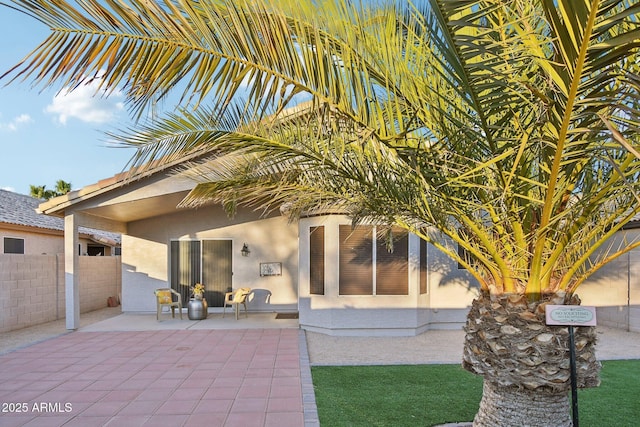 rear view of property with a patio area