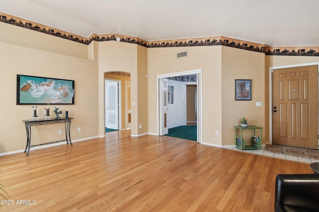 unfurnished living room with hardwood / wood-style floors