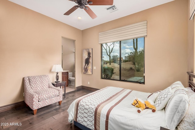 bedroom featuring visible vents, wood finished floors, connected bathroom, baseboards, and ceiling fan