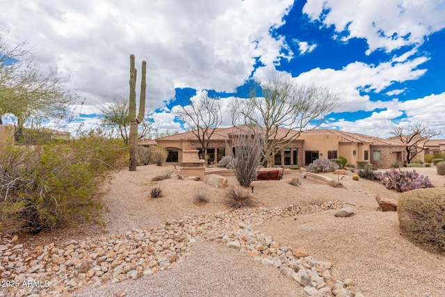 back of property featuring stucco siding and a patio