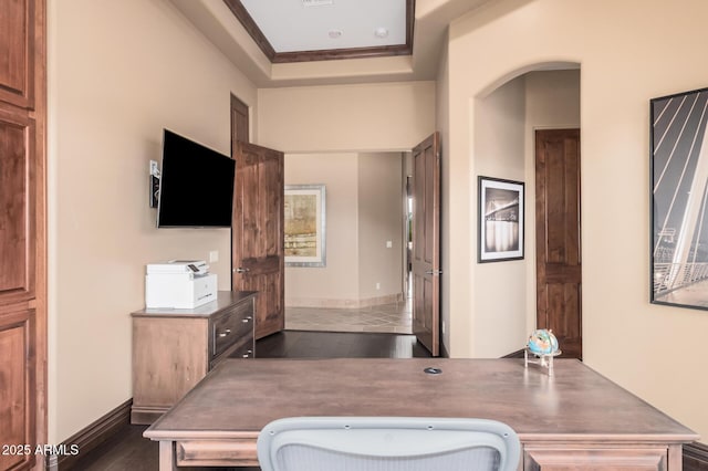 bathroom featuring wood finished floors, baseboards, and ornamental molding