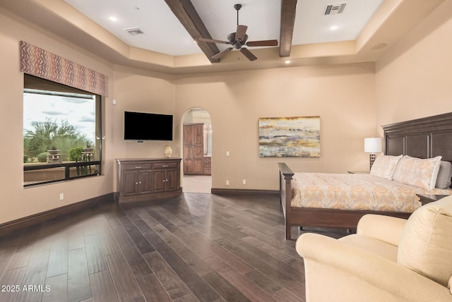 bedroom with visible vents, beam ceiling, arched walkways, baseboards, and dark wood-style flooring