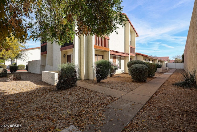 view of front of home with a balcony