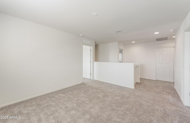 4993 S 254th Dr, Buckeye, AZ 85326 - spare room featuring light carpet, recessed lighting, and baseboards