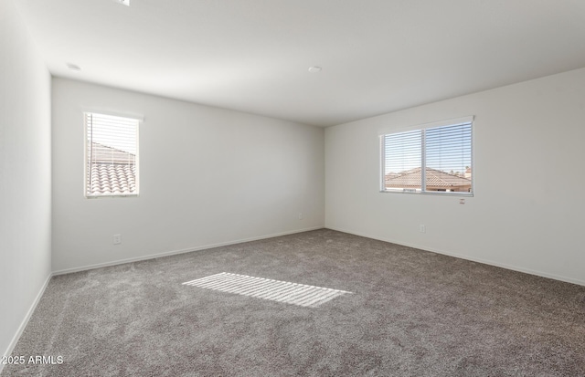 4993 S 254th Dr, Buckeye, AZ 85326 - carpeted empty room featuring healthy amount of natural light and baseboards