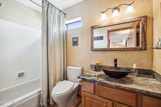 full bathroom with shower / bath combo, vanity, and toilet