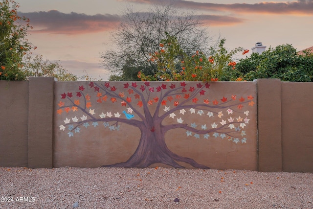 view of gate at dusk