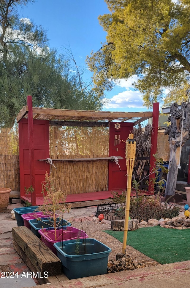 view of playground with a storage shed