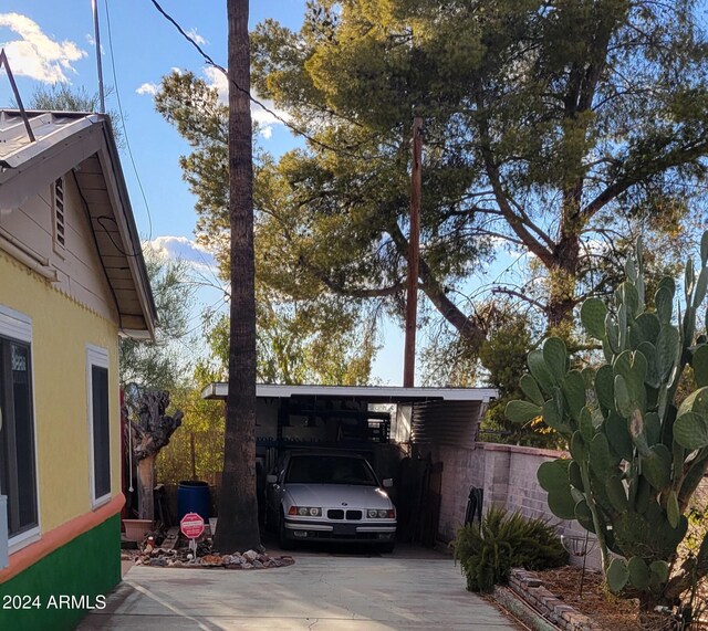 view of home's exterior with a carport