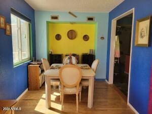 dining area with wood-type flooring