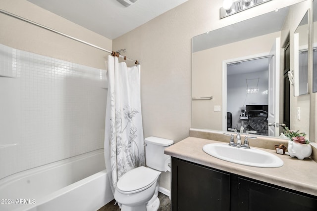 full bathroom featuring shower / bath combo with shower curtain, vanity, and toilet