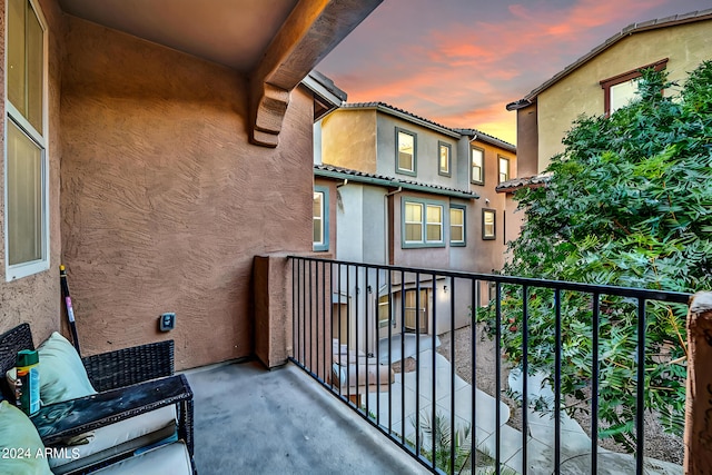 view of balcony at dusk