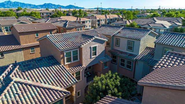 birds eye view of property with a mountain view