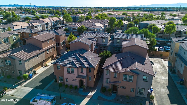 birds eye view of property featuring a mountain view