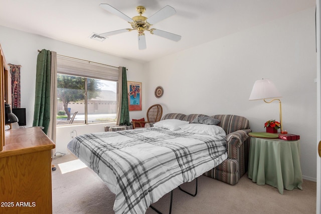 bedroom featuring light carpet, ceiling fan, and visible vents