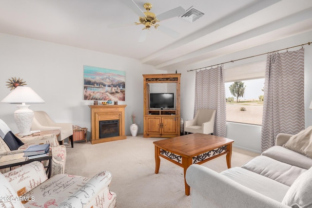 living area featuring a fireplace, visible vents, a ceiling fan, light carpet, and beamed ceiling