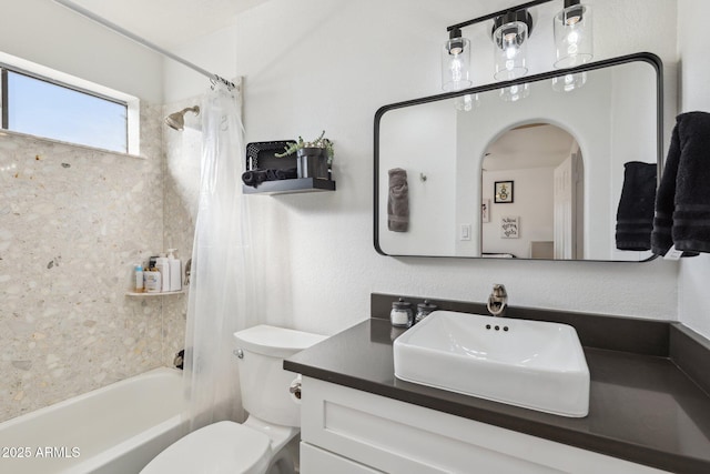 full bathroom featuring vanity, shower / bath combination with curtain, and toilet