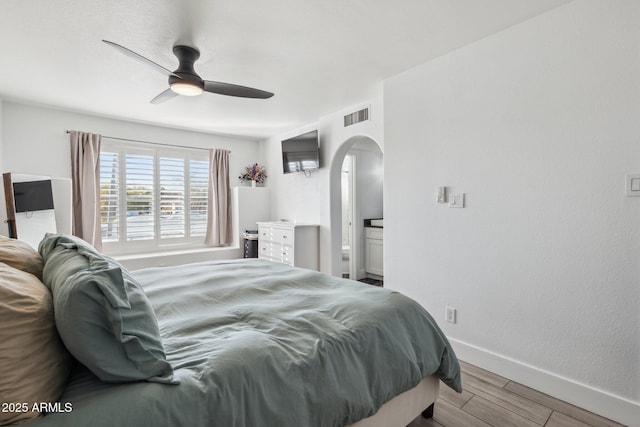 bedroom with light hardwood / wood-style floors and ceiling fan