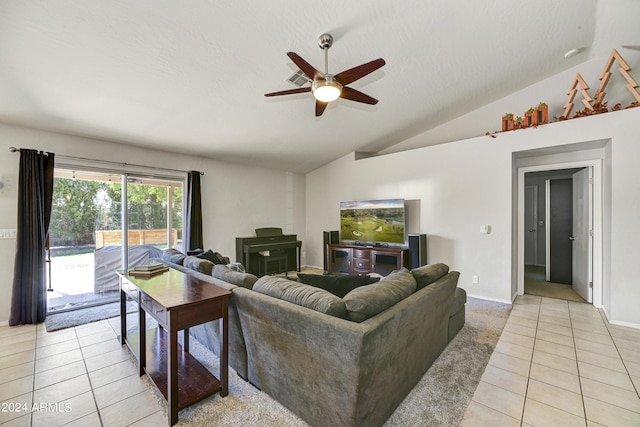 living room featuring ceiling fan, lofted ceiling, and light tile patterned flooring