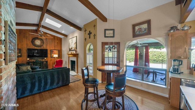 426 E Carol Ann Way, Phoenix, AZ 85022 - dining room with ceiling fan, light wood-type flooring, and a fireplace