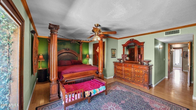 426 E Carol Ann Way, Phoenix, AZ 85022 - bedroom with a textured ceiling, wood finished floors, ornamental molding, and a ceiling fan