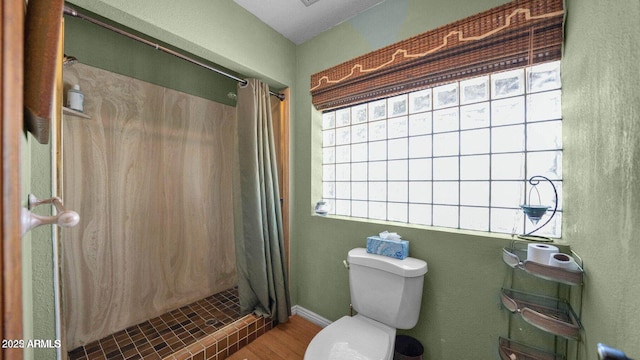 426 E Carol Ann Way, Phoenix, AZ 85022 - bathroom featuring a stall shower and wood finished floors