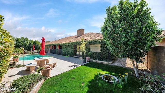 426 E Carol Ann Way, Phoenix, AZ 85022 - rear view of property with a chimney, a fenced backyard, a patio area, and a tile roof