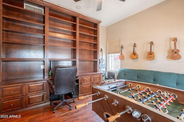 7169 S Dodane Ct, Gilbert, AZ 85298 - playroom with wood finished floors, a ceiling fan, and a desk