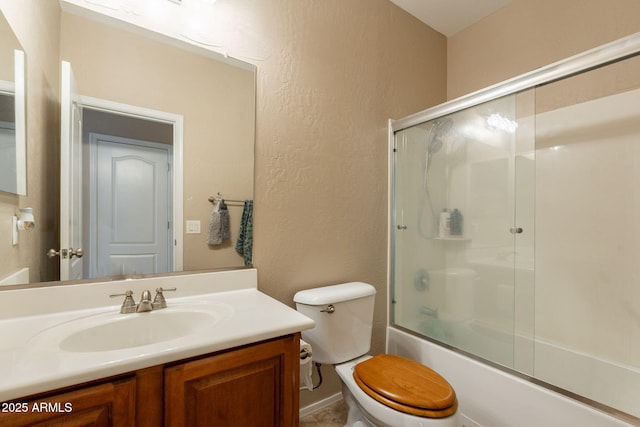 7169 S Dodane Ct, Gilbert, AZ 85298 - bathroom with vanity, a textured wall, toilet, and bath / shower combo with glass door