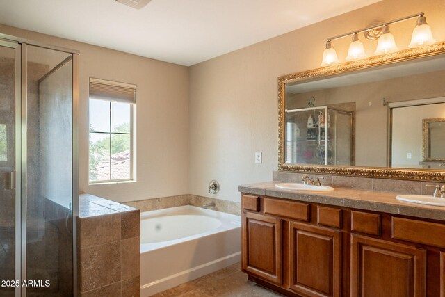 7169 S Dodane Ct, Gilbert, AZ 85298 - bathroom featuring a shower stall, double vanity, a garden tub, and tile patterned flooring