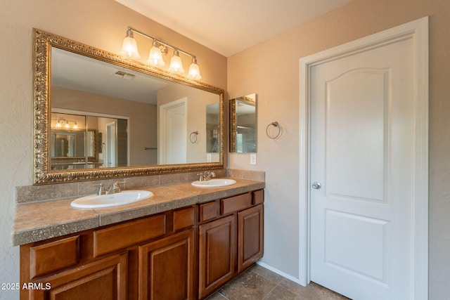 7169 S Dodane Ct, Gilbert, AZ 85298 - bathroom featuring double vanity, tile patterned floors, and baseboards