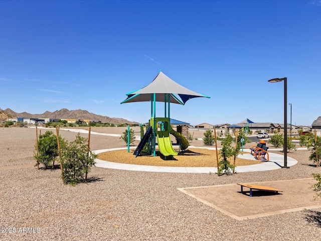 view of playground with a mountain view